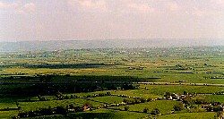 Looking northeast from Brent Knoll, Mendips in the distance